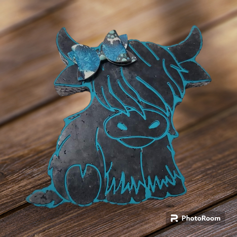 Black and Blue Highland Sitting Cow